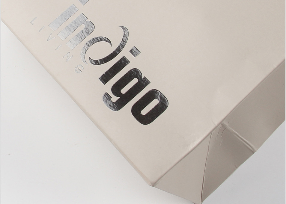 Eco Friendly Paper Shopping Bags With Nylon Rope Handles And Spot UV Surface Finishing