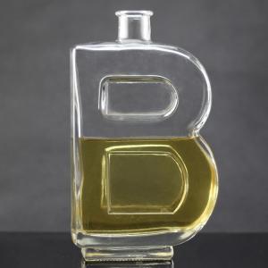 China Base Material Glass Bottle with Unique Letter Shape and Cork Cap on sale