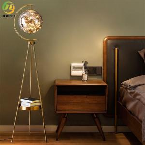 China Modern Simple Iron Floor Lamp Tripod Glass Shade Floor Light for Living Room on sale