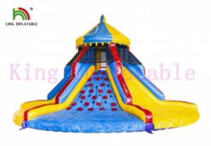 China PVC Colorful Blow Up Carousel Dry Slide Tower Slide With Climbing Wall For Kids on sale