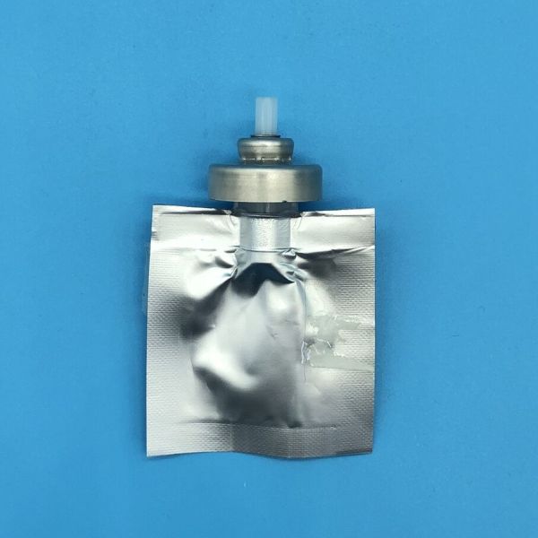 Male Bag-on-Valve aerosol component close-up