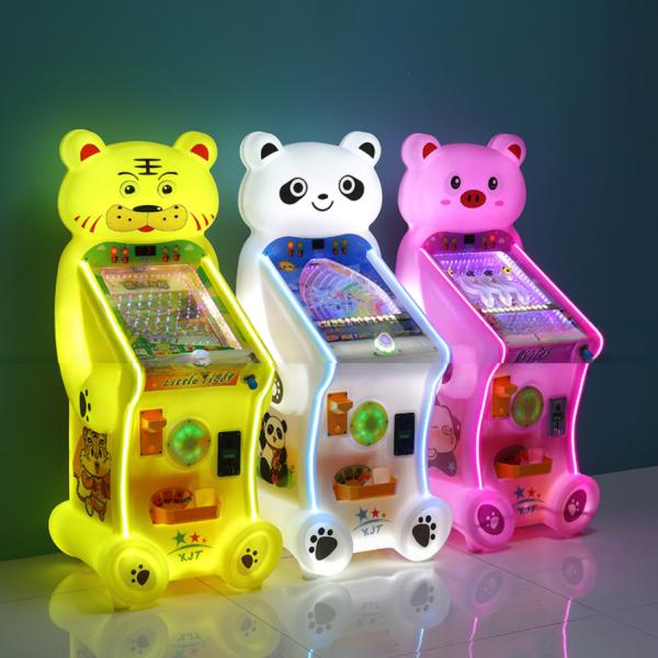 Children playing with the marble game machine