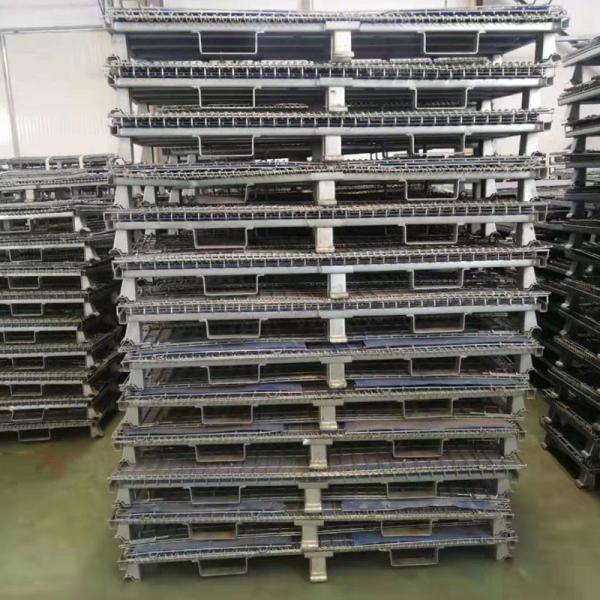 Worker handling foldable storage container