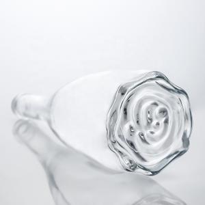 China Custom Logo Unique Floral Bottom Super Flint Long Neck 750ml Glass Bottle for Gin Cork on sale