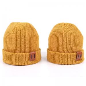 China Leather Patch Knit Beanie Hats Custom Design Warm Hat Cap Yellow Beanie Hats on sale