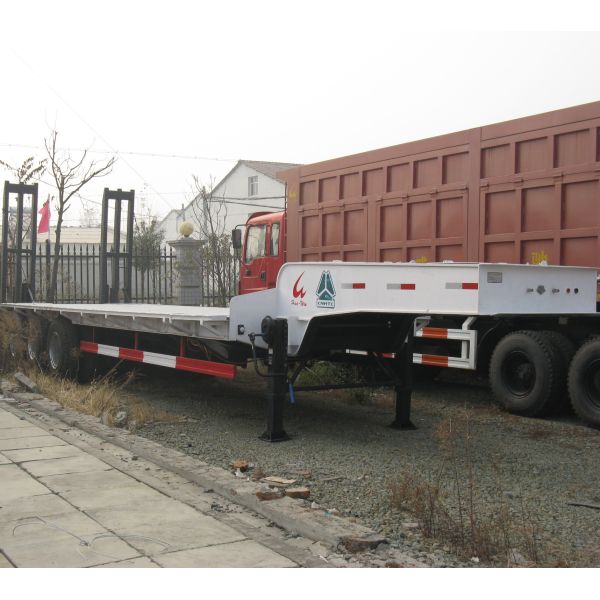 Heavy Duty Extendable 3 axles new lowbed semi trailer howo second hand 20 ft 40 ft truck flatbed semi trailers for container