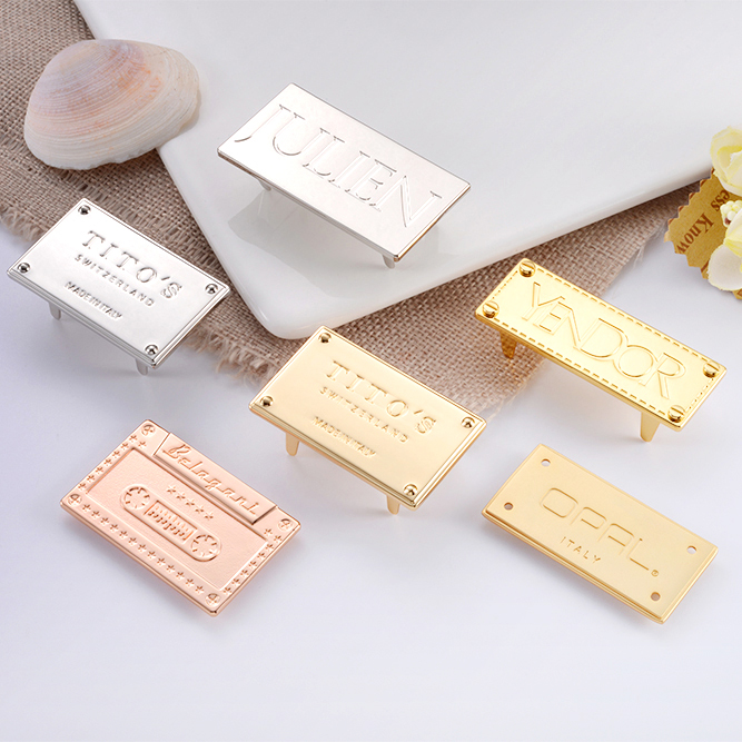 Custom Adhesive Metal Name Tags With Logo For Perfume Bottle Gold Embossed Label On Black Background