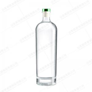 China Design Short Neck Thick Bottom Craft Fine Wine Glass Bottle with Colored T Tap on sale